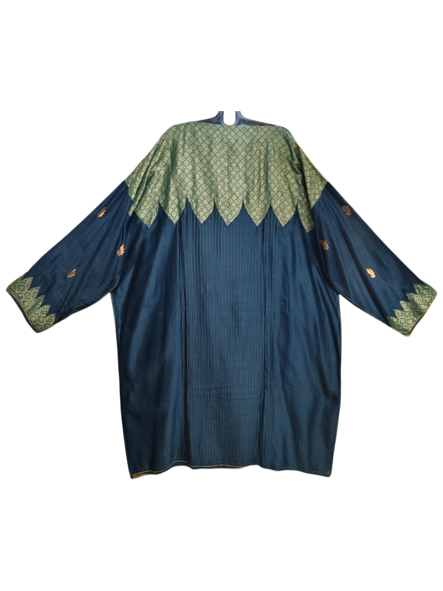 Blue kurta with green lace detailing on a white background