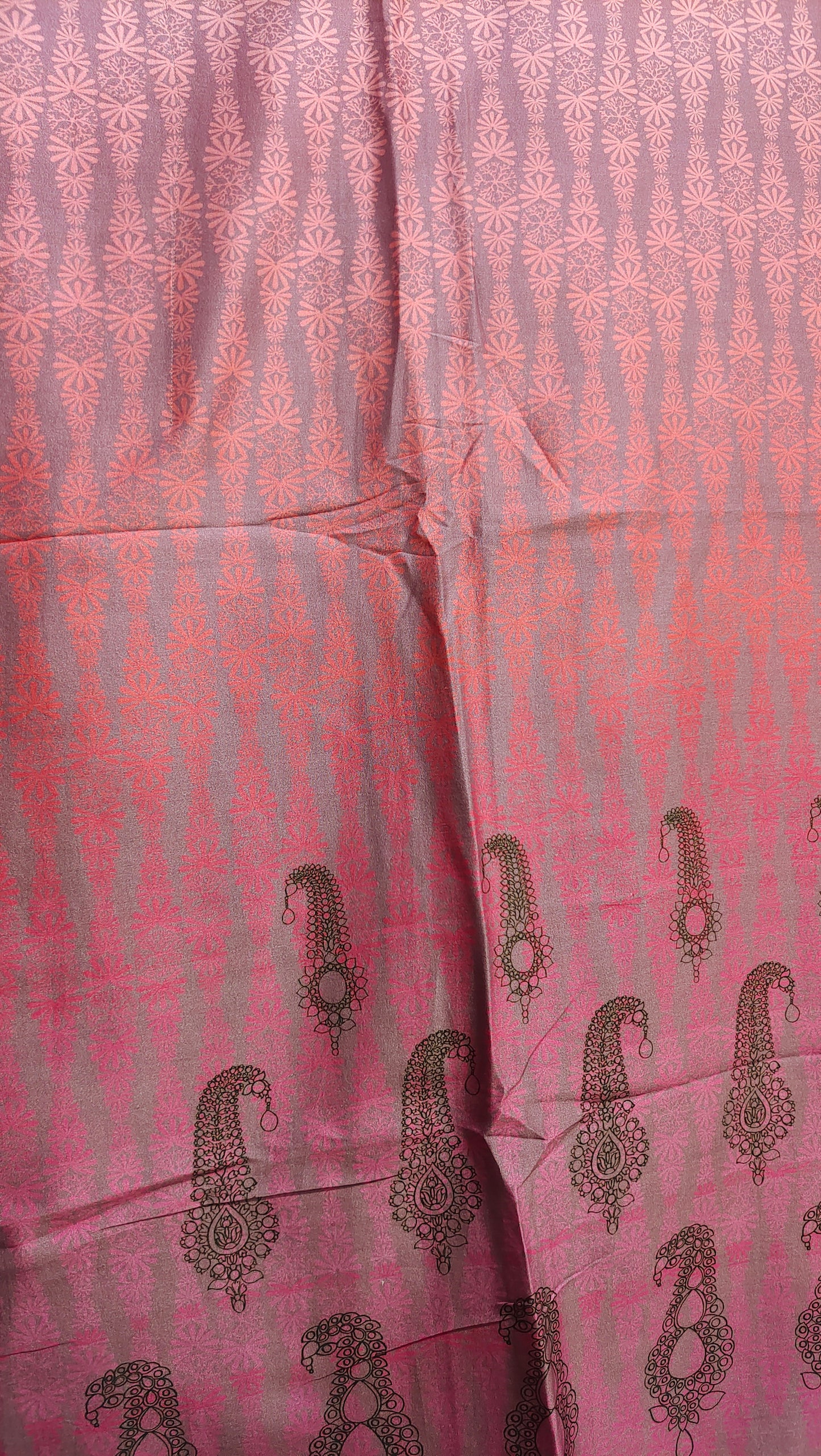 Pink fabric with black patterns, possibly a or fabric swatch.