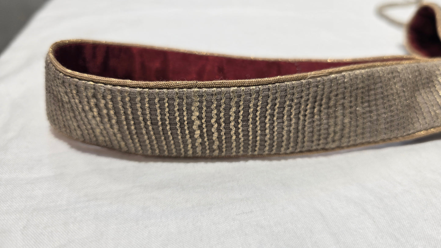 Textured belt on a light gray background