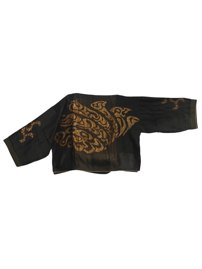 Black garment with gold embroidery on a white background