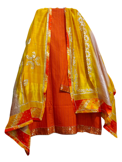 Orange and yellow traditional kurta with a dupatta on a white background