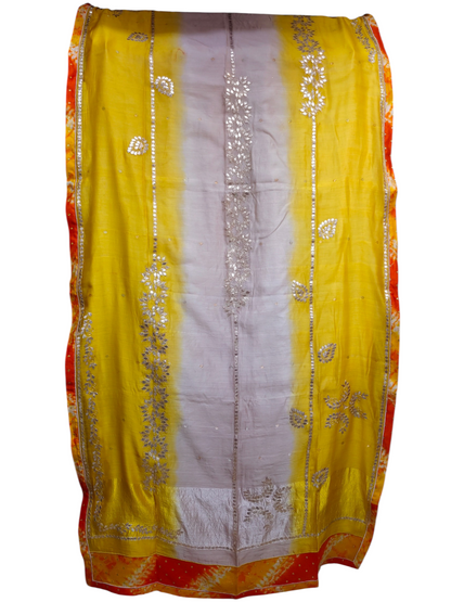Yellow and white dupatta with floral patterns on a plain background