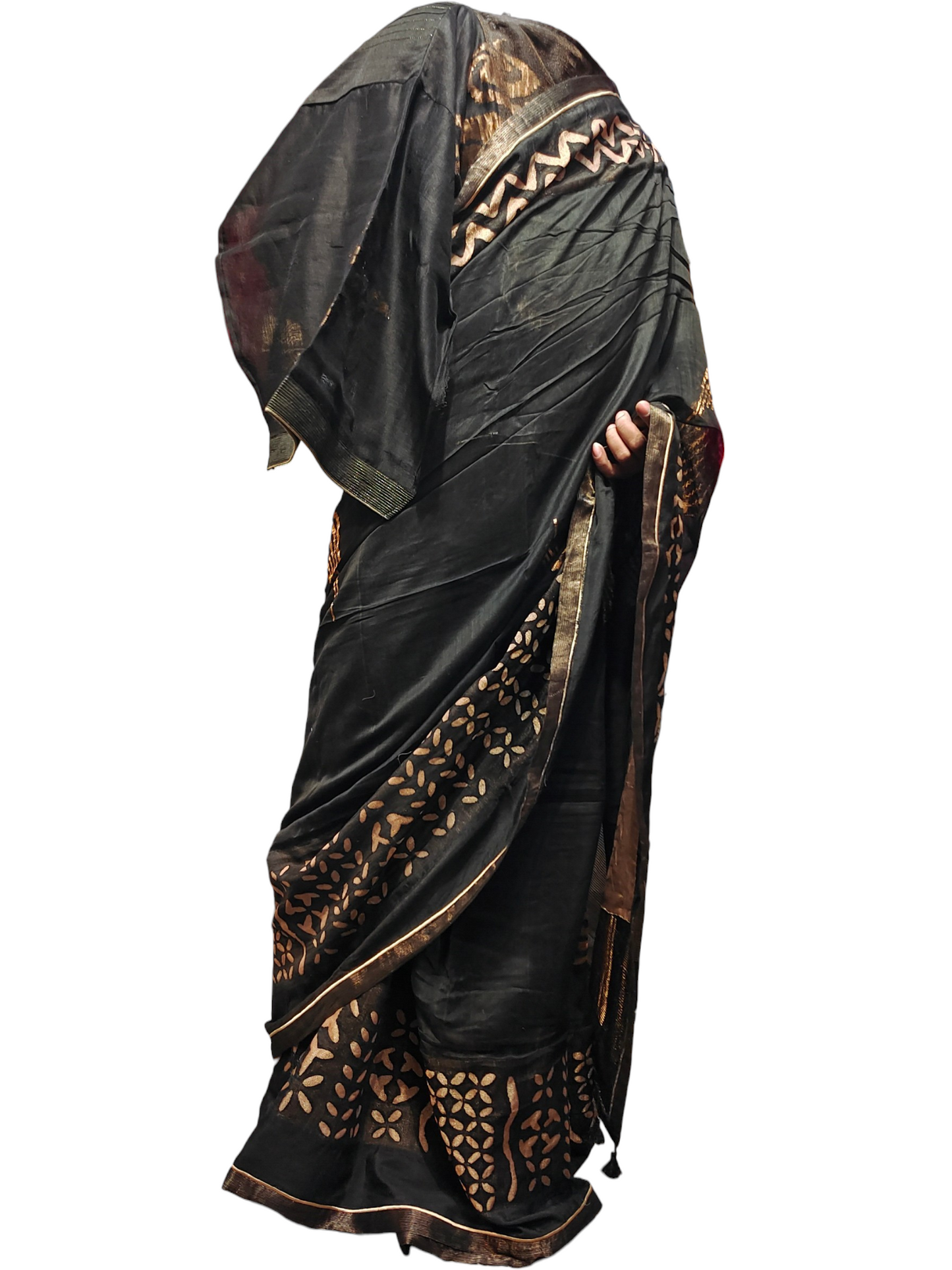 Black saree with gold patterns on a white background