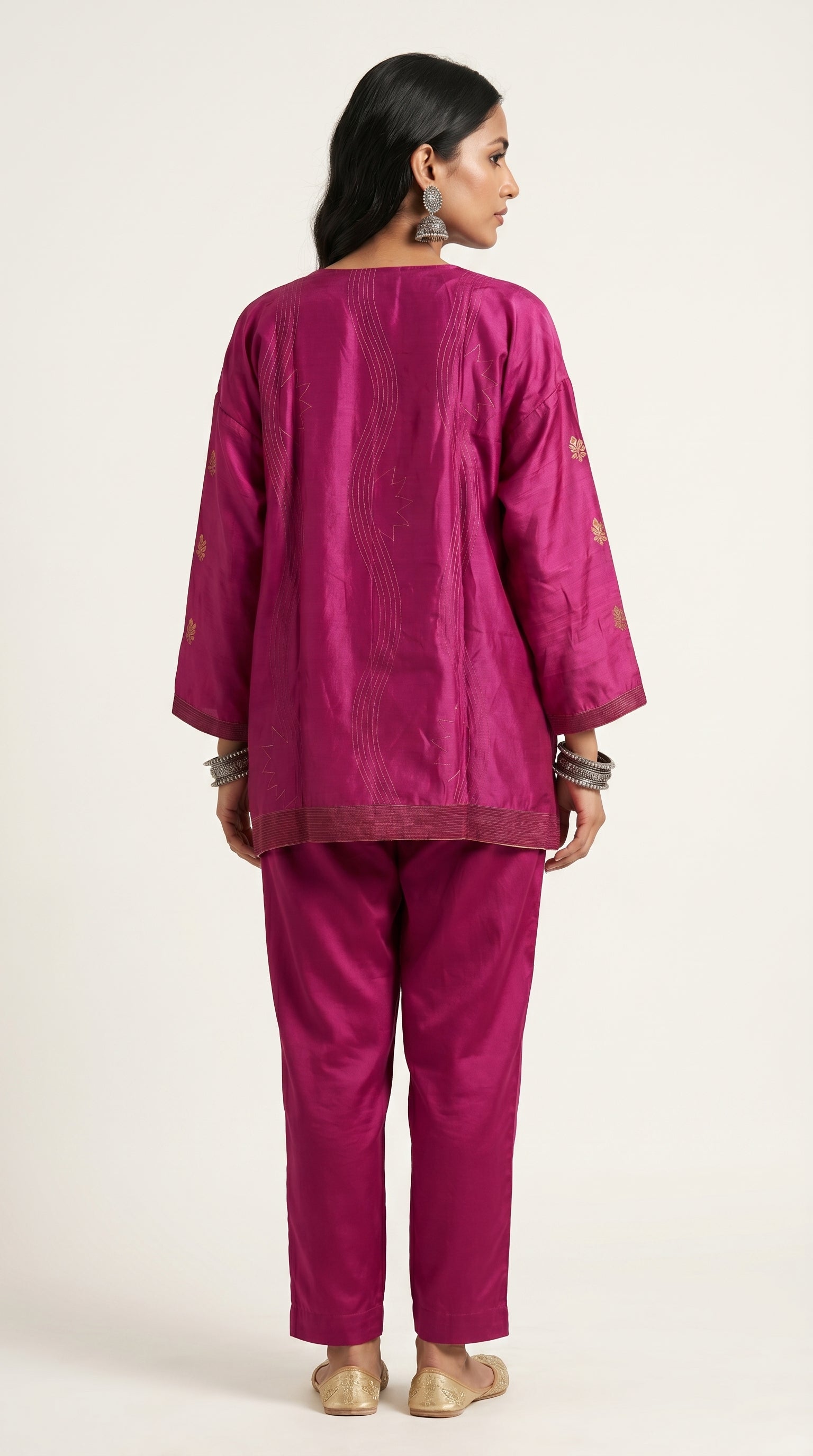 Woman wearing a pink traditional outfit on a white background