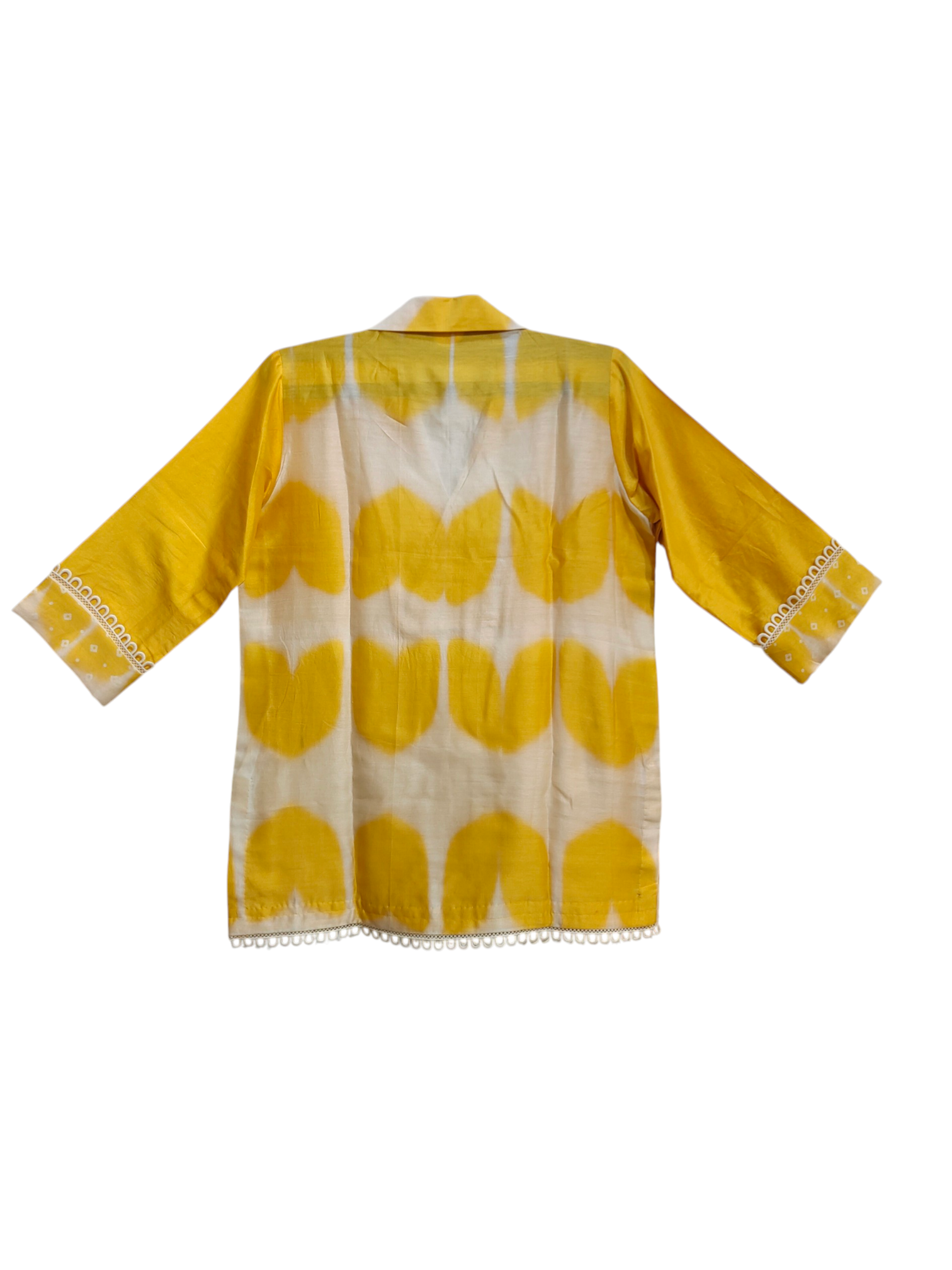 Yellow and white patterned top on a white background