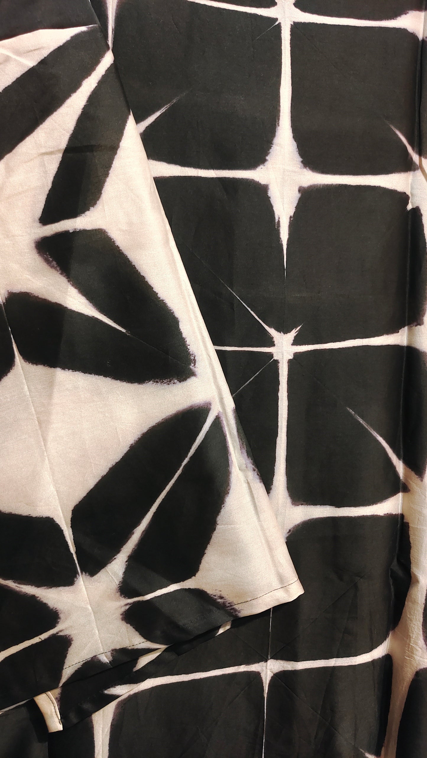 Black and white patterned fabric with a diamond design