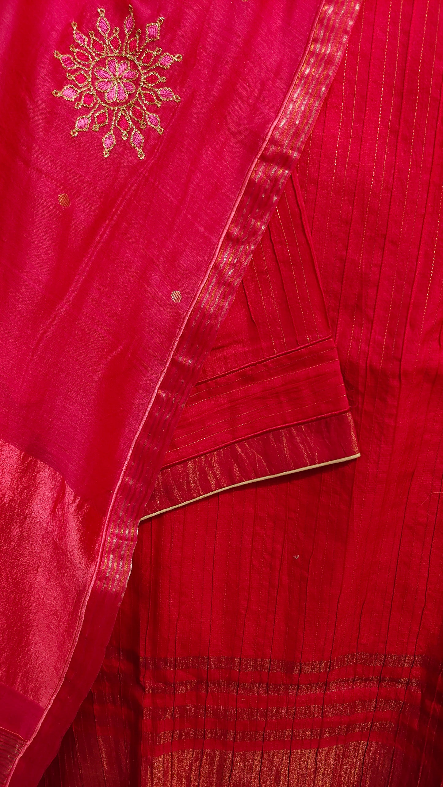 Red fabric with gold embroidery and border