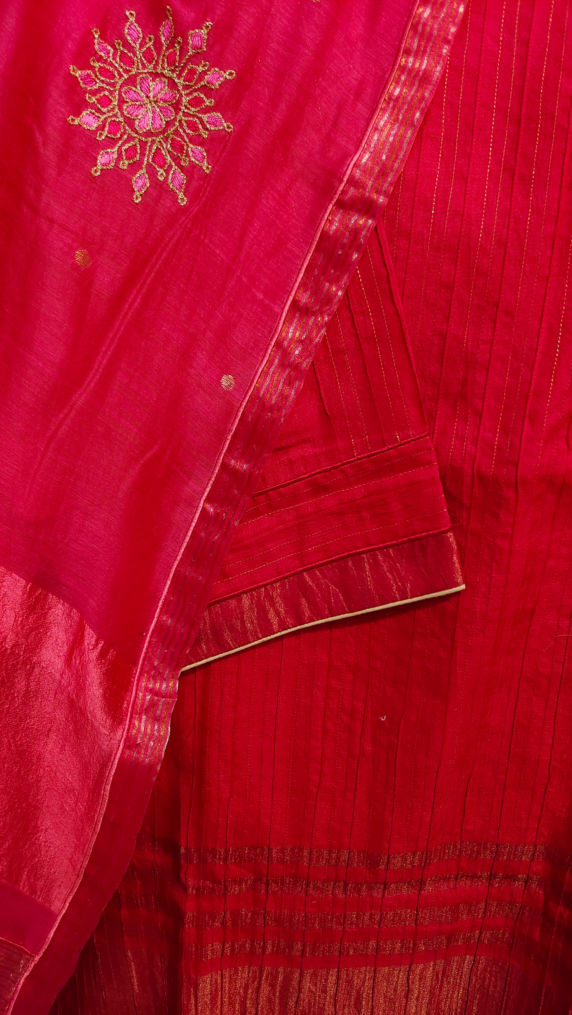 Red fabric with gold embroidery and border