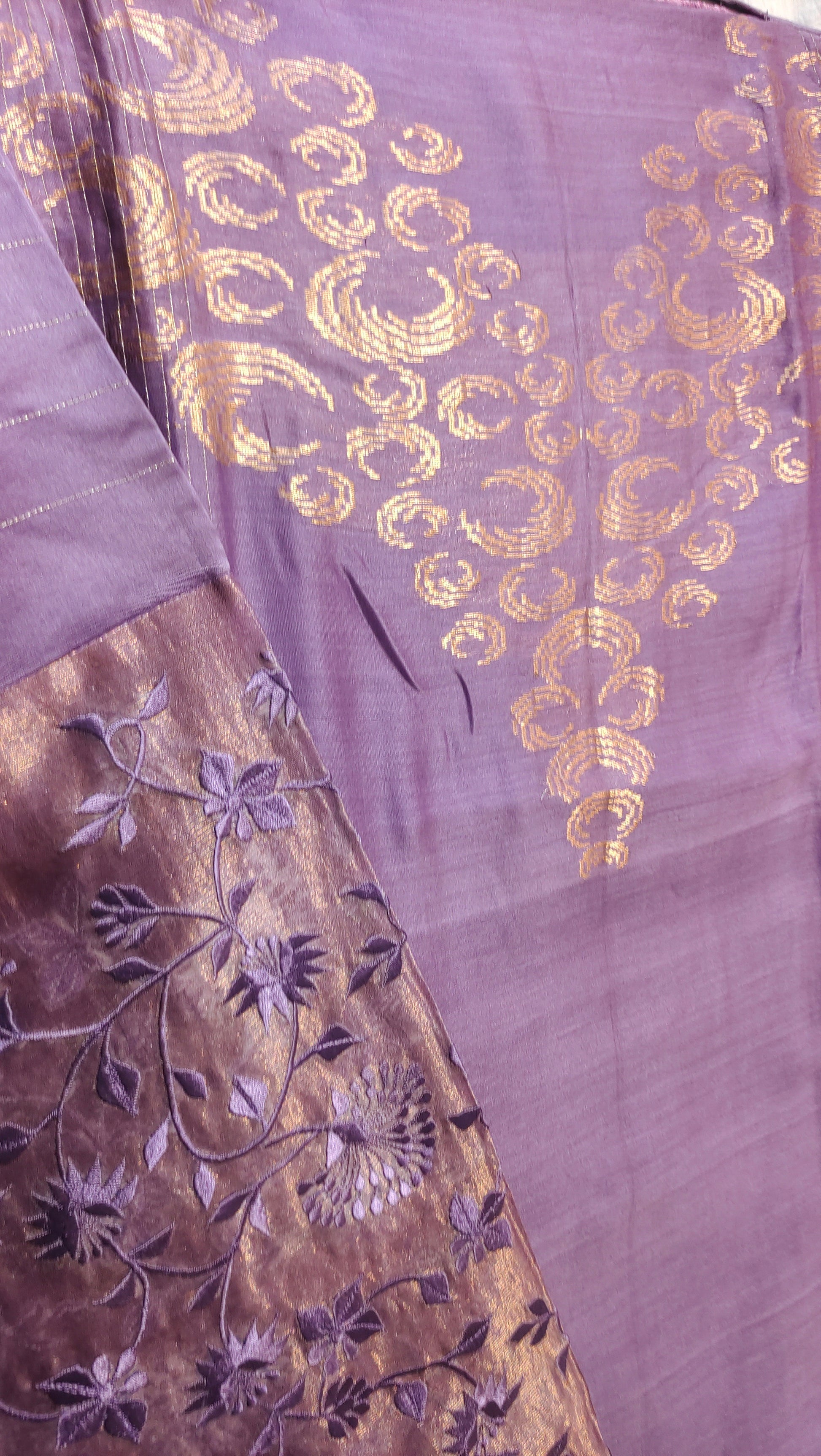 Embroidered fabric with gold and purple patterns