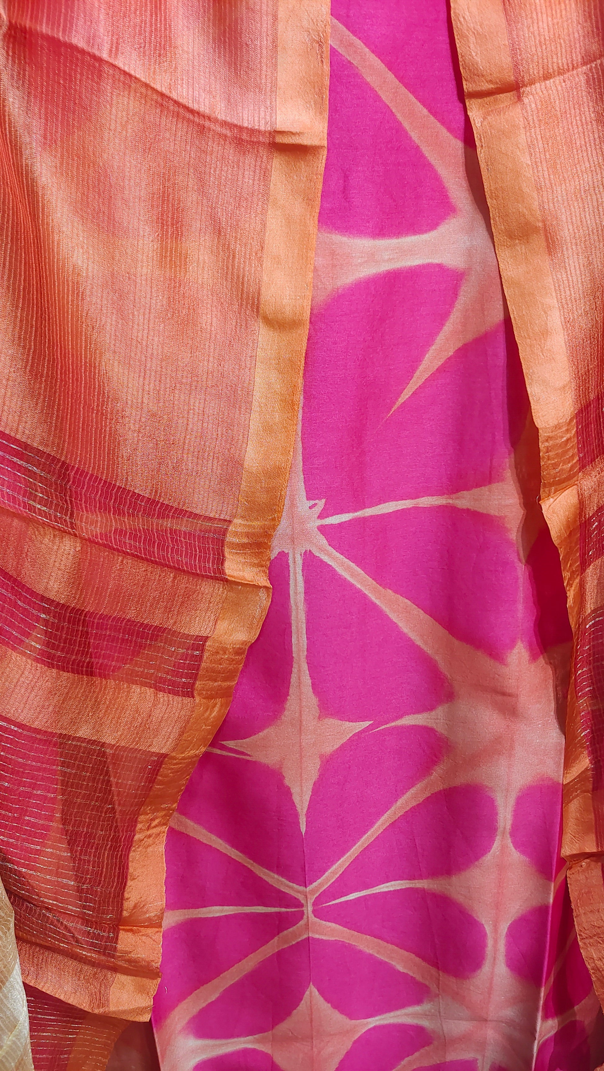 Close-up of a fabric with pink and orange pattern