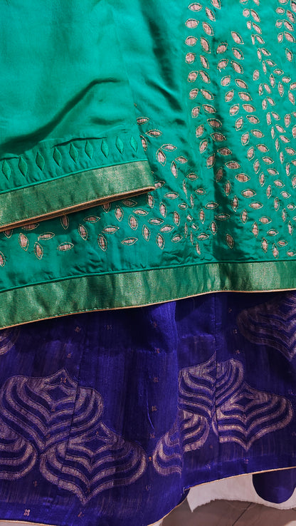 Close-up of green and blue fabric with intricate patterns