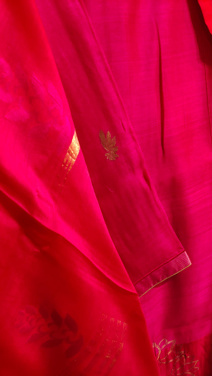 Close-up of a red fabric with gold embroidery