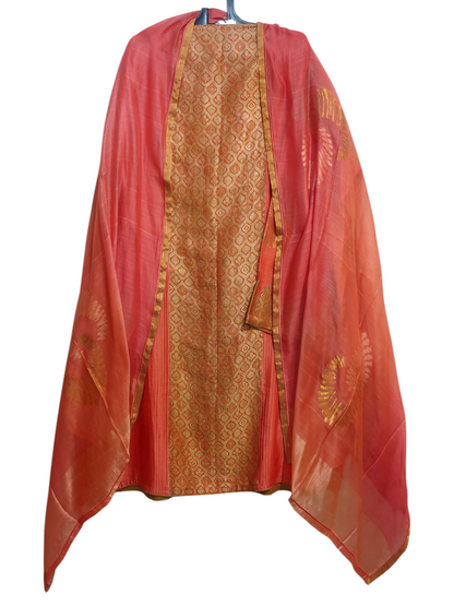 Peach and gold traditional suit with on a white background