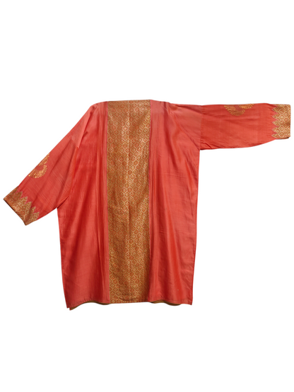 Peach suit with gold embroidery on a white background