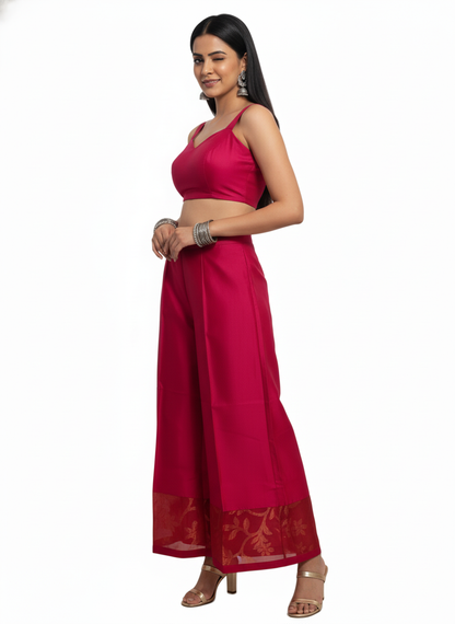 Woman wearing a pink traditional plazzo with a white background